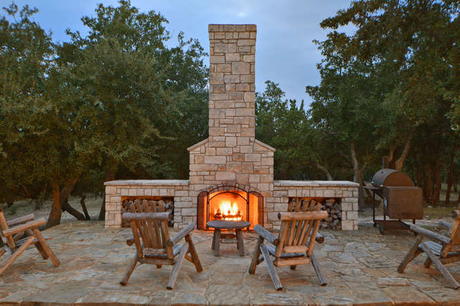 DeKeratry Custom home with patio fireplace