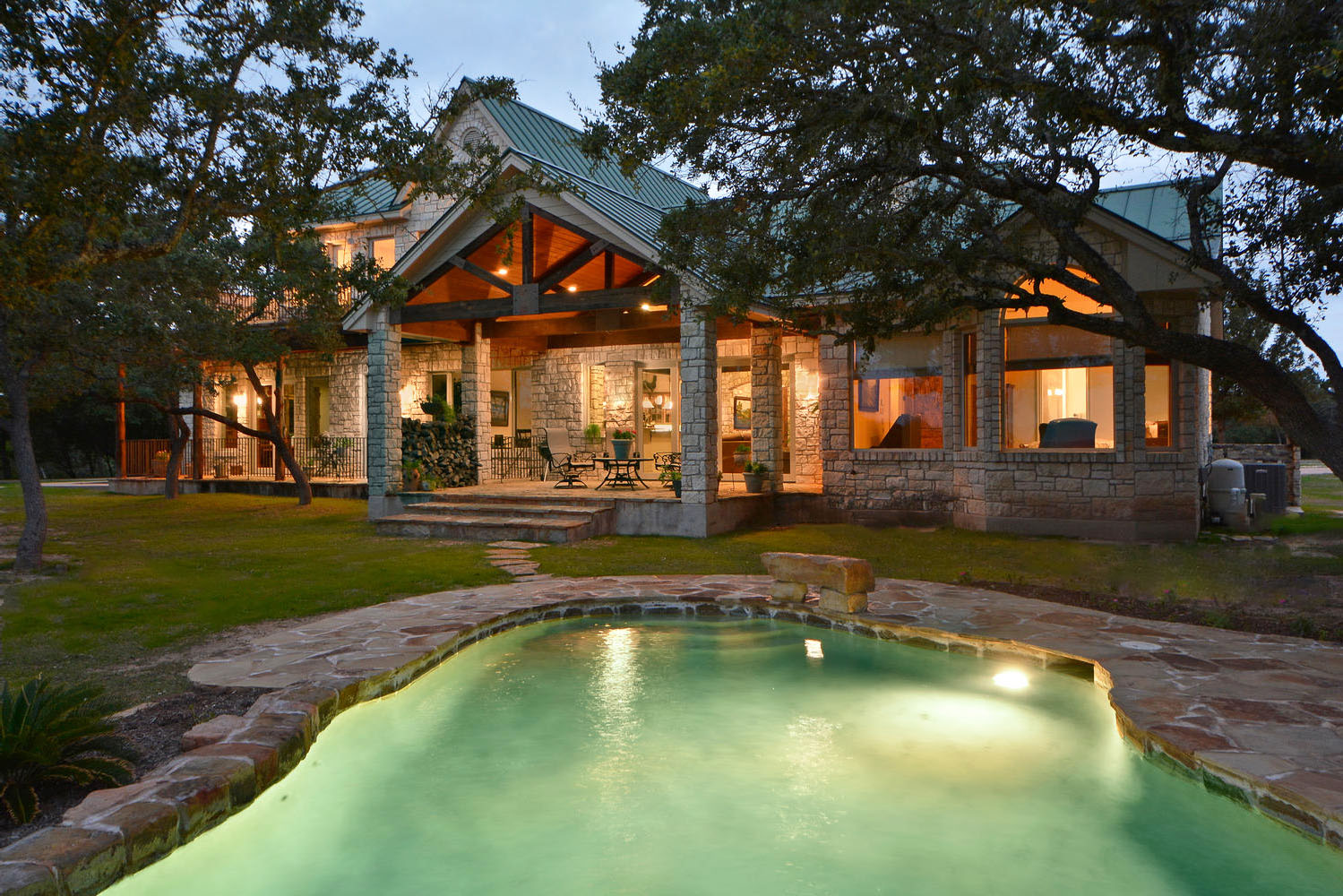 Edgewater Ranch Travis County home exterior view with pool and patio